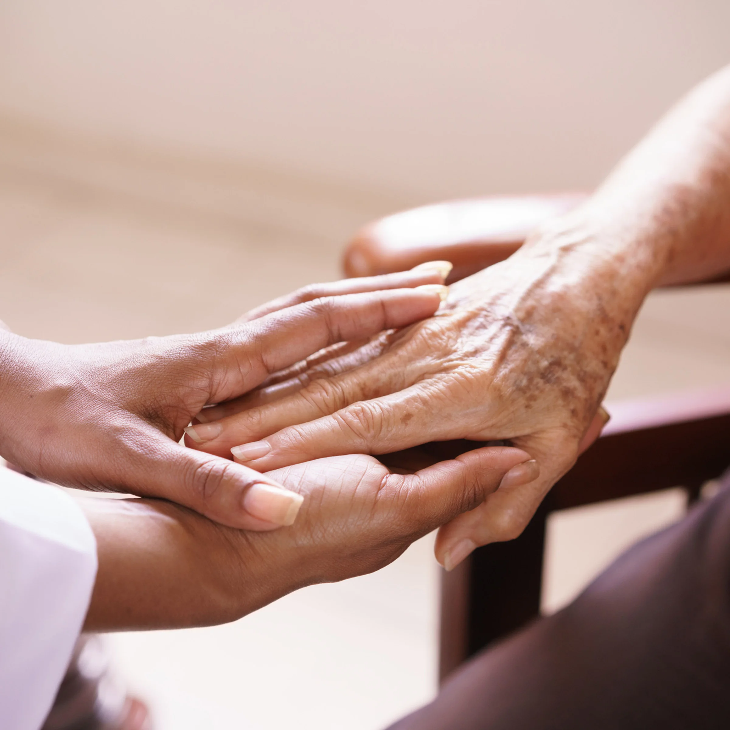 Caregiver and client hands meeting